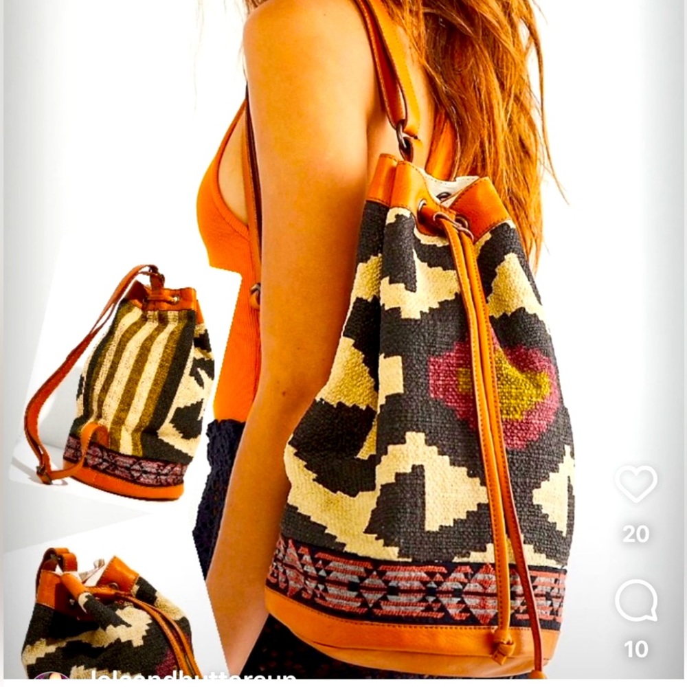 Free People drawstring bucket bag. On trend, amazing boho stitched bucket bag.